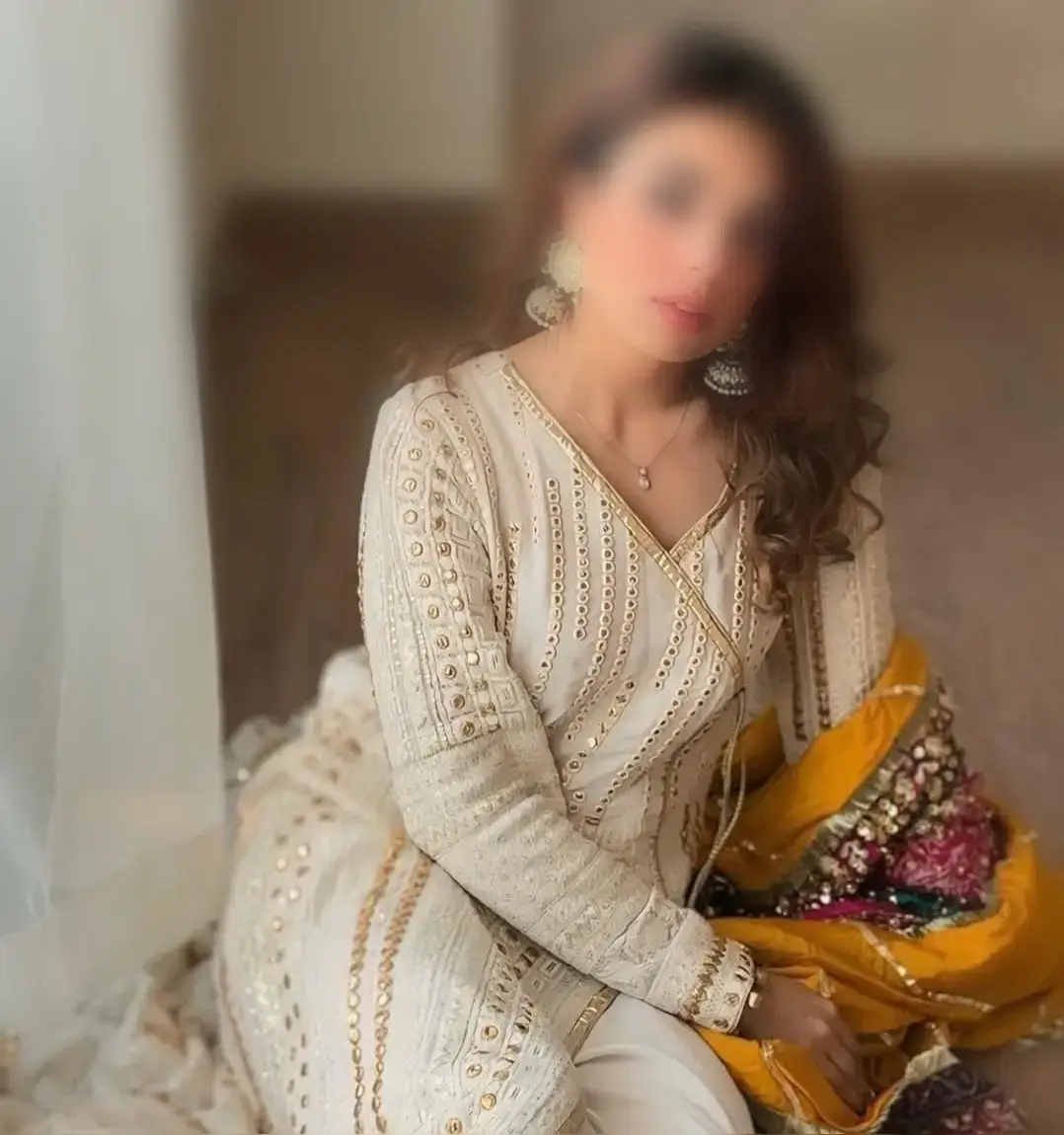 Gorgeous Aparna sitting quietly in a secure room, offering the safest escorts in Dubai Motor City experience.